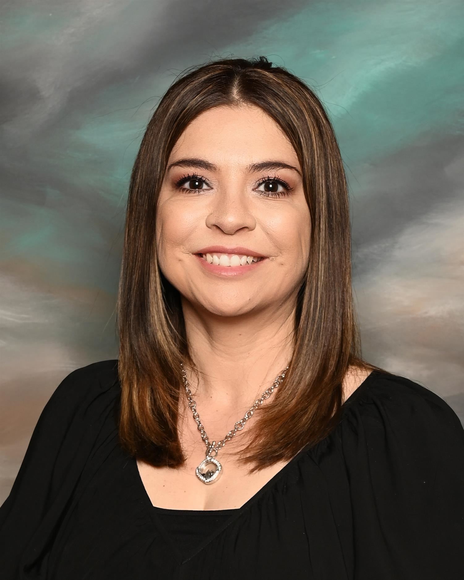 Dr. Carmen Corrales